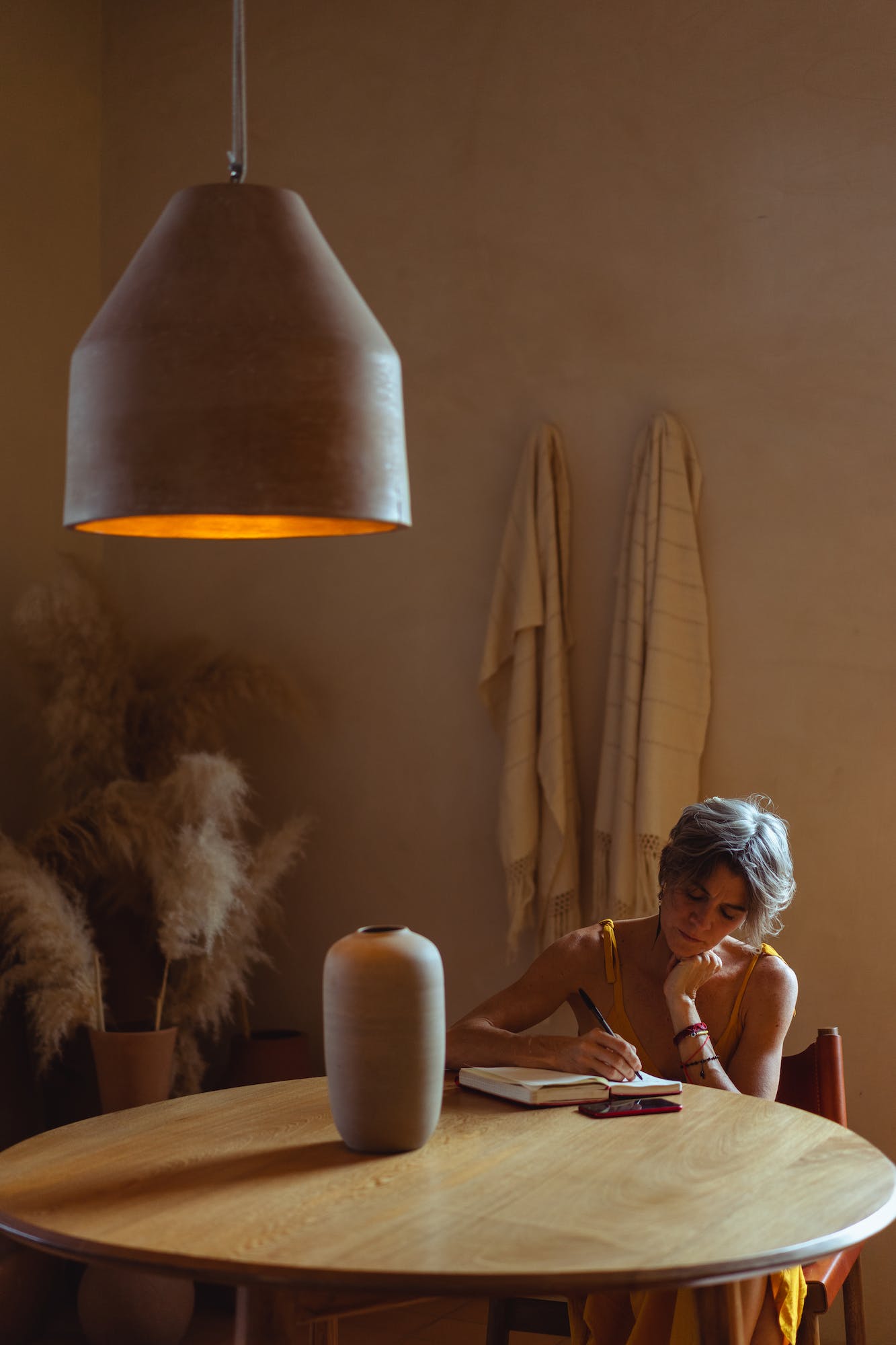 Photo by Los Muertos Crew Elderly Woman Busy Writing